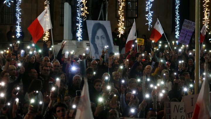 Protesters hold flags of Malta during a demonstration demanding justice over the murder of journalist Daphne Caruana Galizia, outside the Court of Justice, in Valletta Malta.