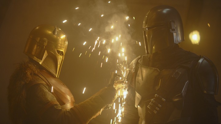 The Armorer (left) and the Mandalorian (right).
