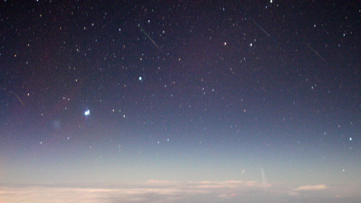 A view of meteors, originating in the constellation Auriga, streaking through the night sky