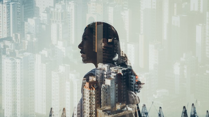 Woman's silhouette against cityscape