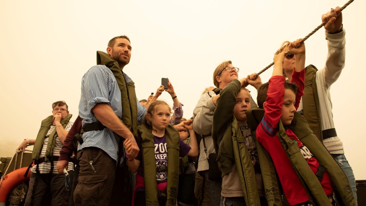 Evacuees flee Australia's ongoing bushfires.