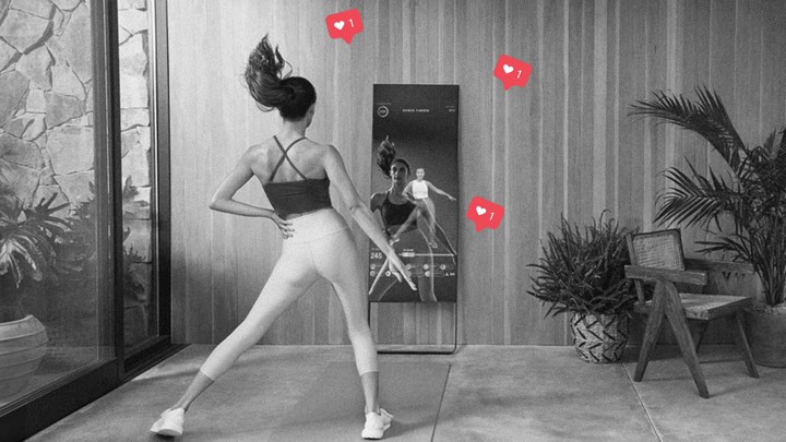 A photo of a woman using a Mirror