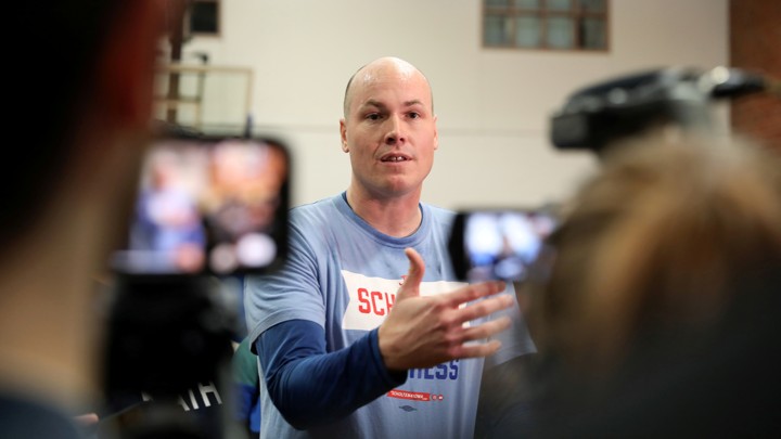 The congressional candidate J. D. Scholten talks to reporters.
