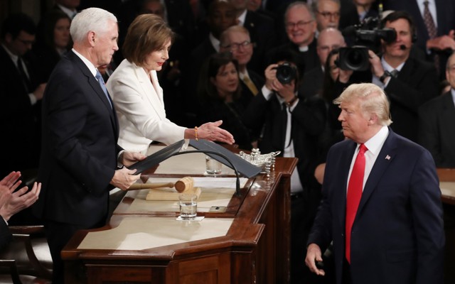 Donald Trump arrives in Congress to deliver the State of the Union. He refuses to shake Nancy Pelosi's hand.