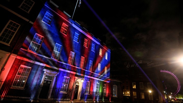 Lights are put on display at 10 Downing Street with the London Eye in the background