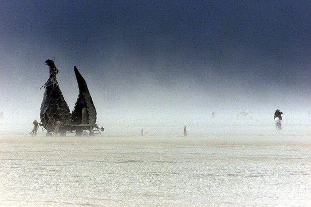 09 a bicycle rider makes it through a dense sand storm at