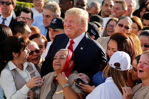 Donald Trump poses with employees at his Doral Country Club Tuesday morning.