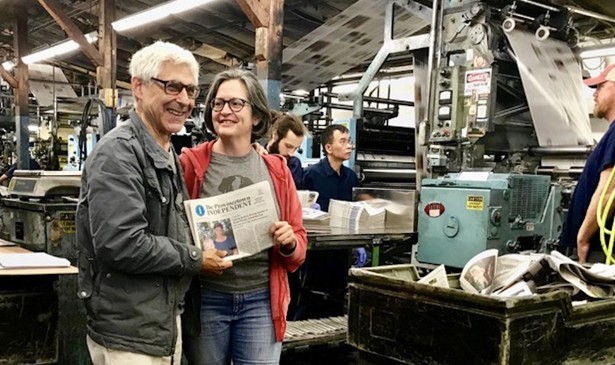 Editor Ed Miller and publisher Teresa Parker with Vol. 1 No. 1 of The Provincetown Independent as it comes off the press on Sept. 6