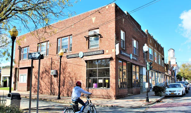 The Shawangunk Journal offices in Ellenville, New York. Backwards sign made by artist Roger Baker.