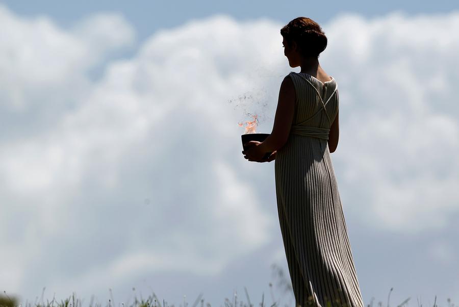 Lighting The 2018 Olympic Flame Atlantic A Priestess Holding Lit Cauldron Performs In The Final Dress Rehearsal For Lighting Of Flame Held On May 9 2018 Ancient Olympia Greece