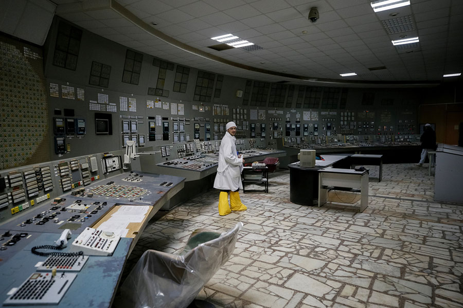  An employee walks in the control center of the stopped third reactor of the Chernobyl nuclear power plant in Chernobyl, Ukraine, on April 20, 2018. # Gleb Garanich / Reuters