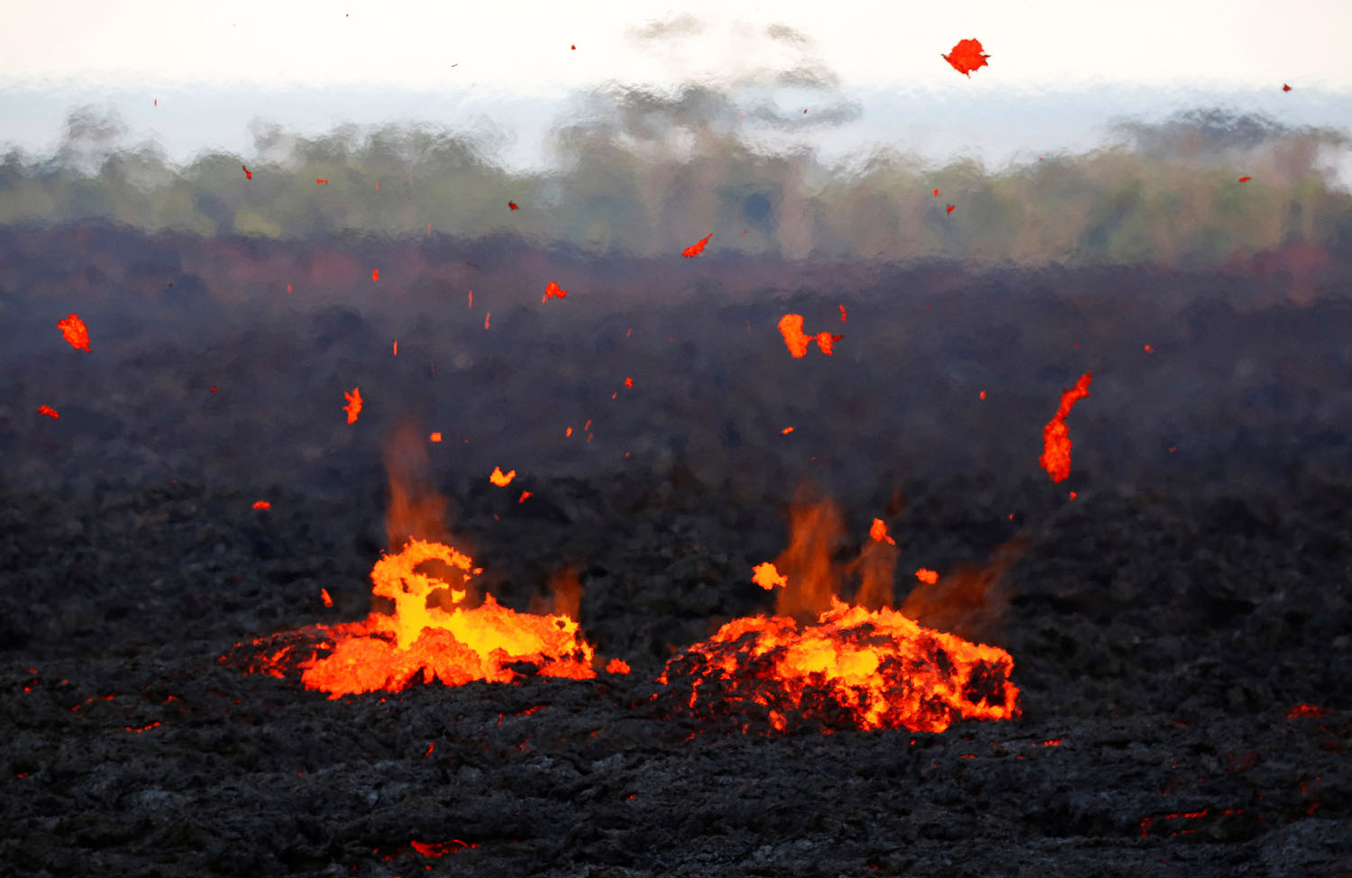 lava erupts from a fissure by Terray Sylvester