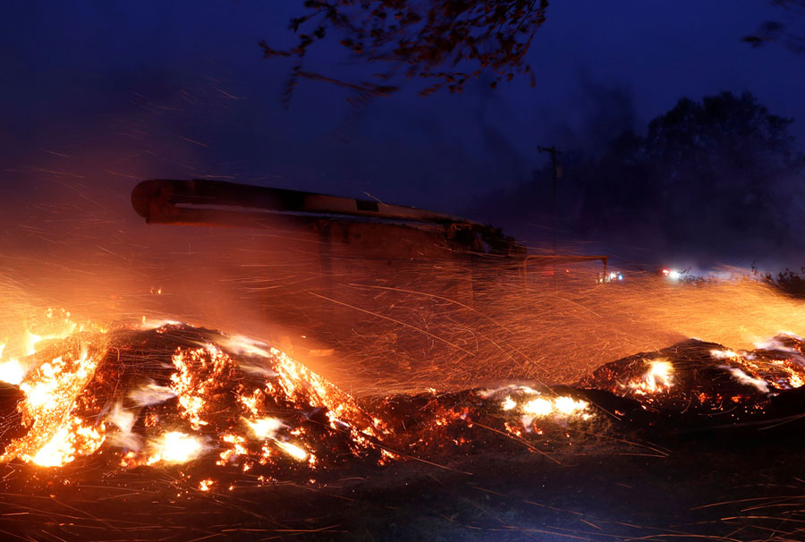 Photos Embers Fly in California’s WindDriven Wildfires The Atlantic