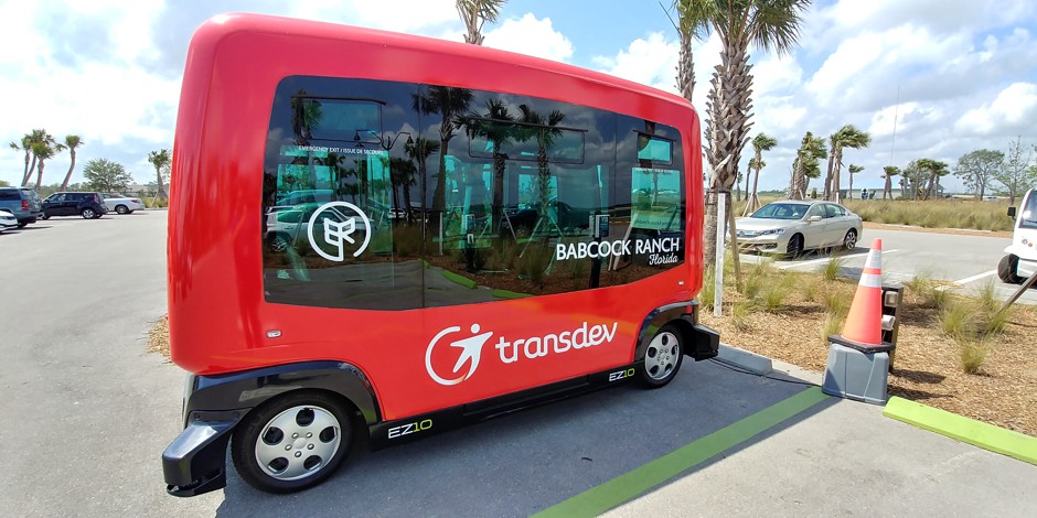 red transdev automated shuttle parked at babcock ranch