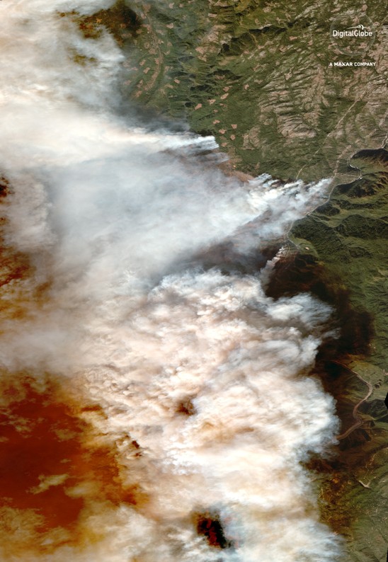 A satellite images shows smoke from the Camp Fire floating across California. 