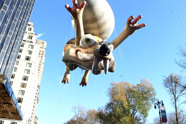 Scat, the excitable squirrel from the movie Ice Age, in giant balloon form flying over the Macy's Thanksgiving Day Parade.