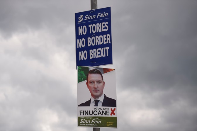 A photo of a Sinn Fein poster reading 'No Tories. No Border. No Brexit.'