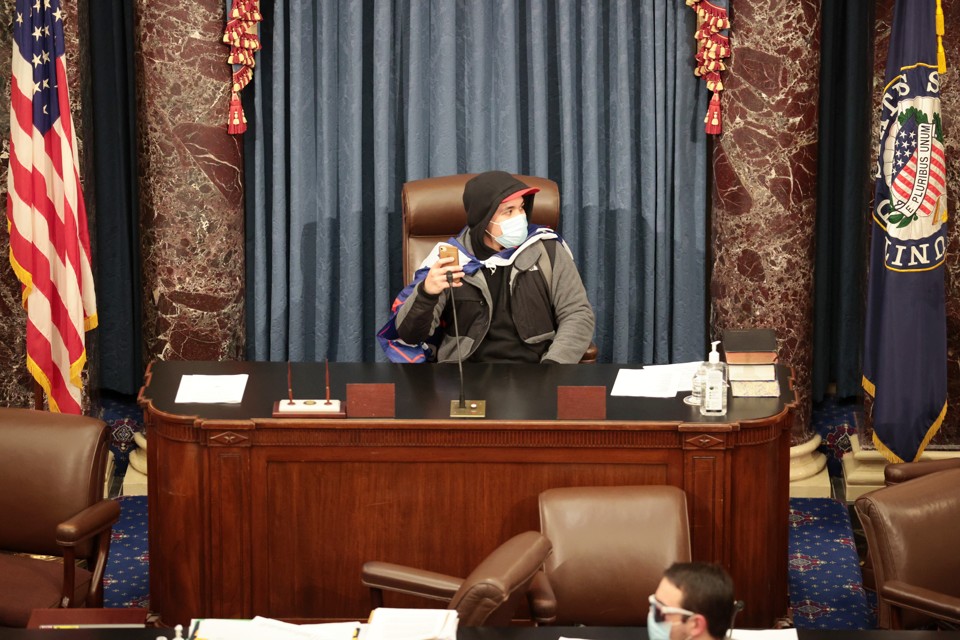 insurrectionist sitting in senate chamber