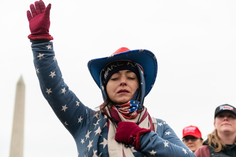 woman with raised hand