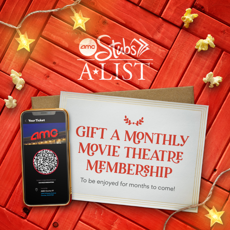 An AMC Stubs A-List promotional photo with a card that reads "GIFT A MONTHLY MOVIE THEATRE MEMBERSIP to be enjoyed for months to come!" and a phone displaying a movie ticket. 