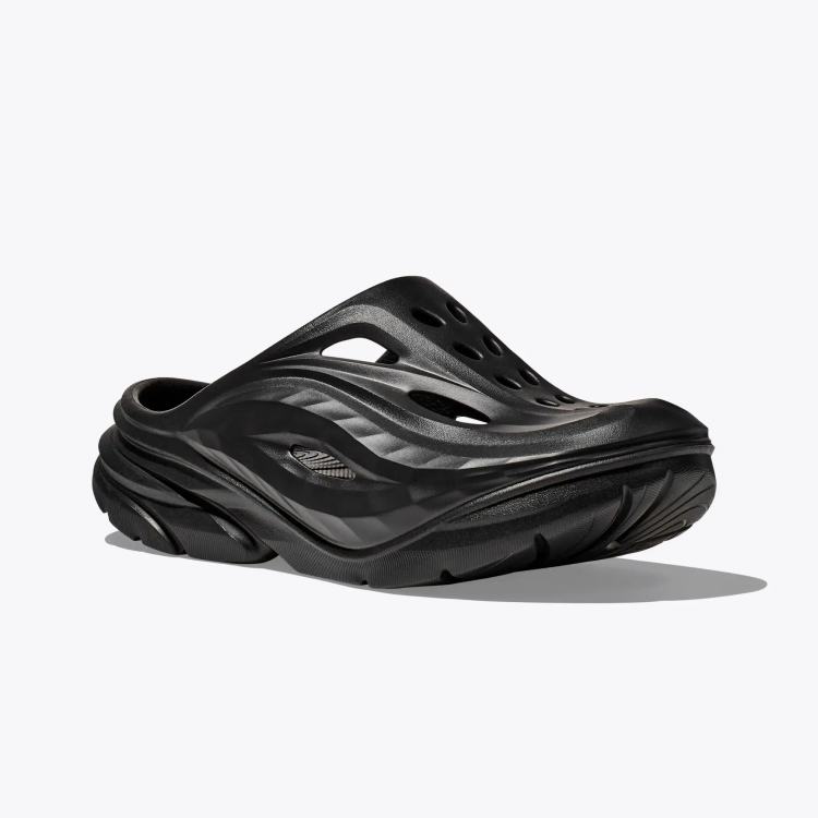 A black Hoka mule. 