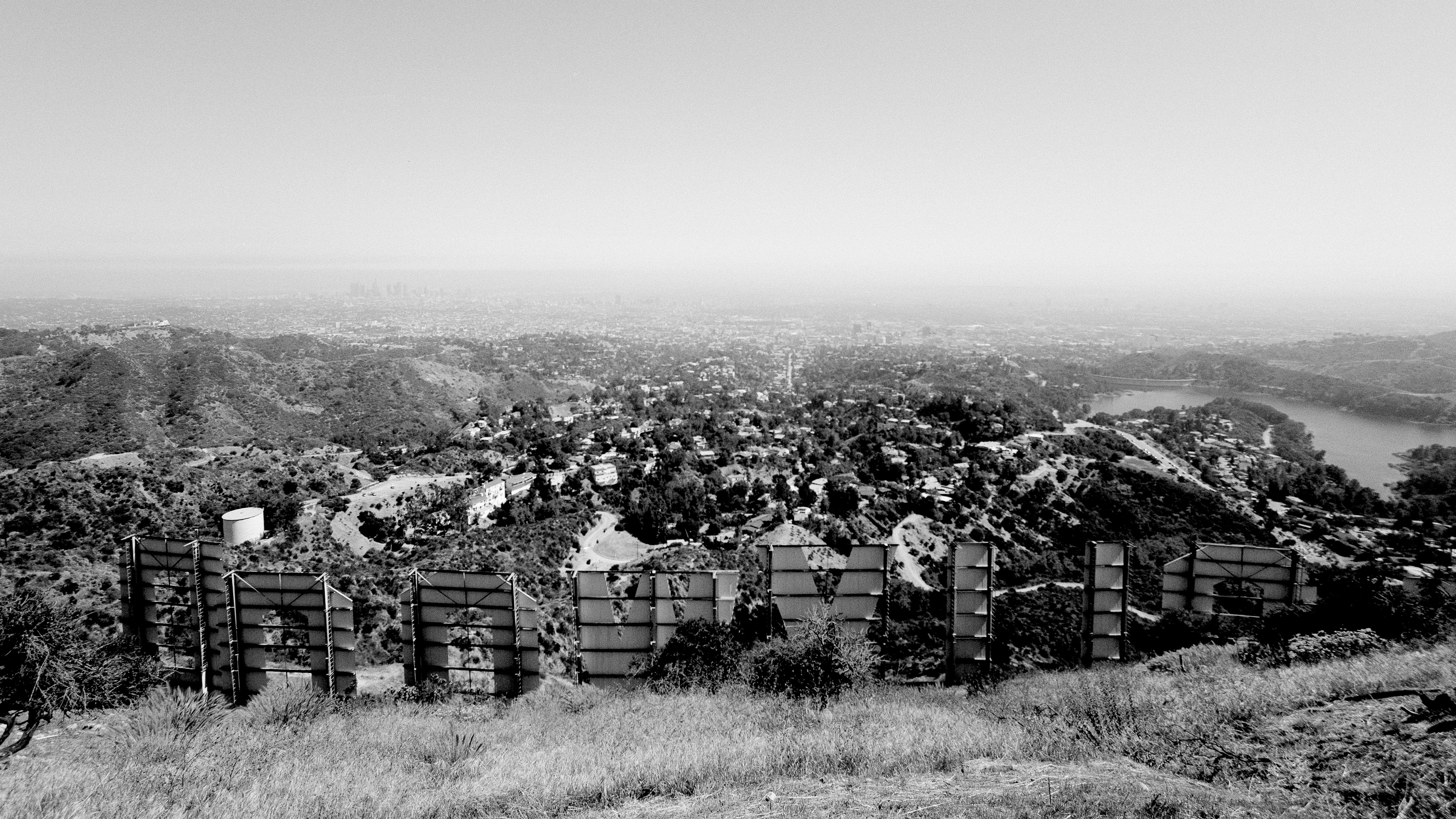 The Hollywood sign seen from behind in black and white
