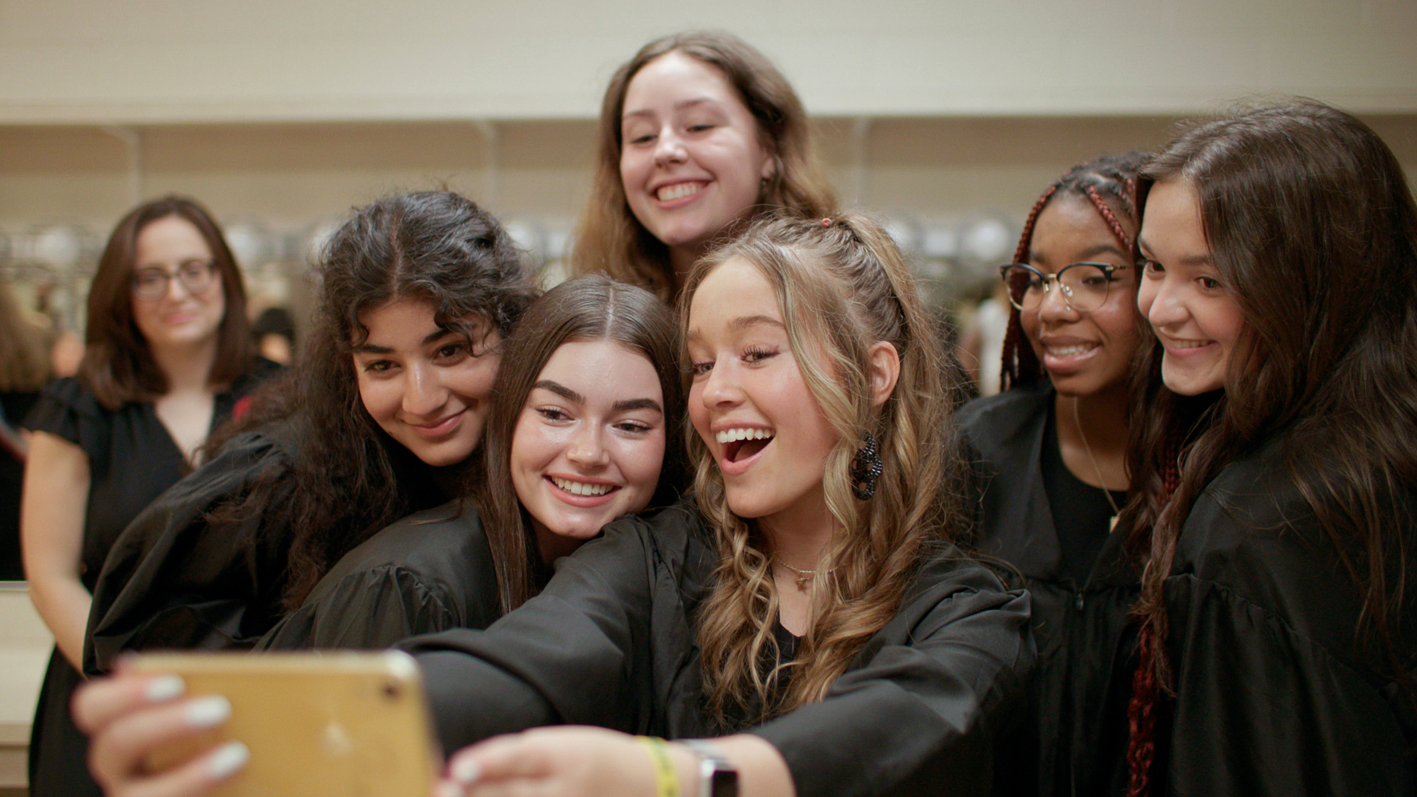 Teenagers pose for a selfie in a scene from "Girls State"