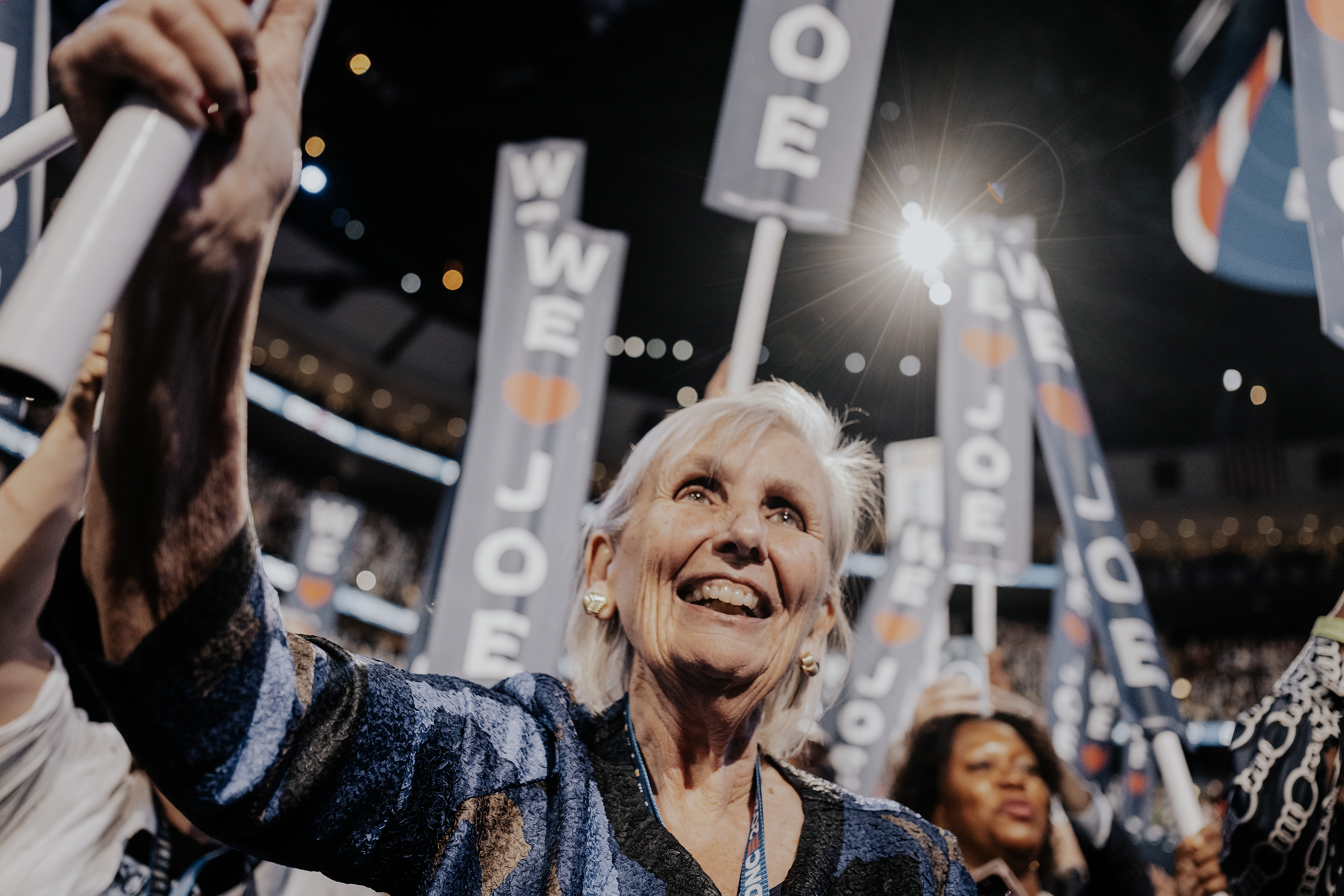 An older white woman appears enthusiastic at the Democratic Party Convention