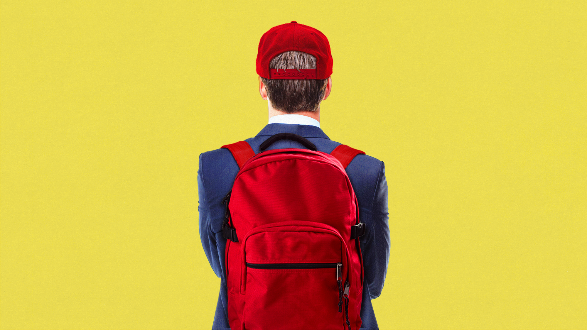 Young man in a suit wearing MAGA hat and red backpack