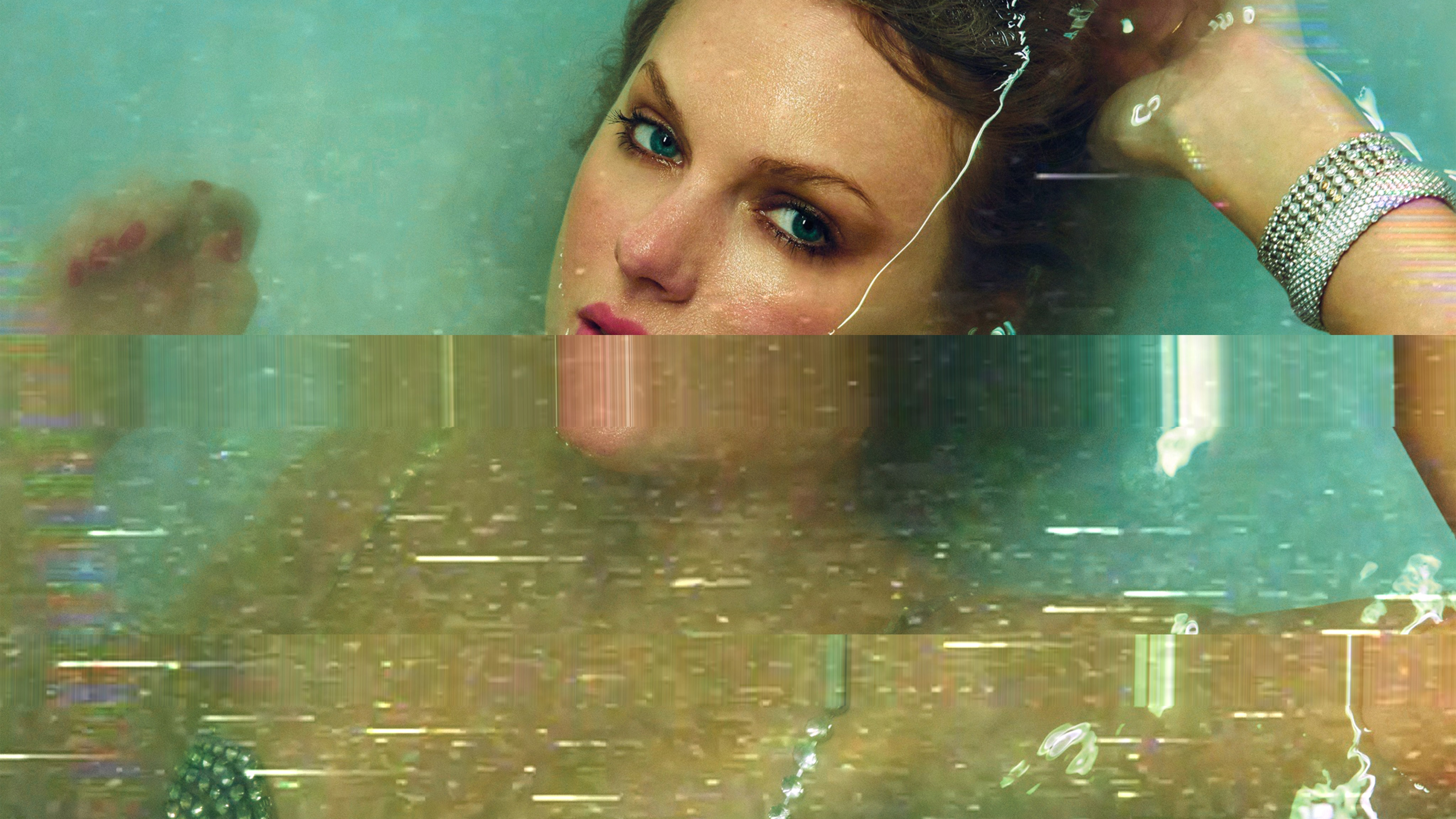 A color image of Taylor Swift halfway underwater
