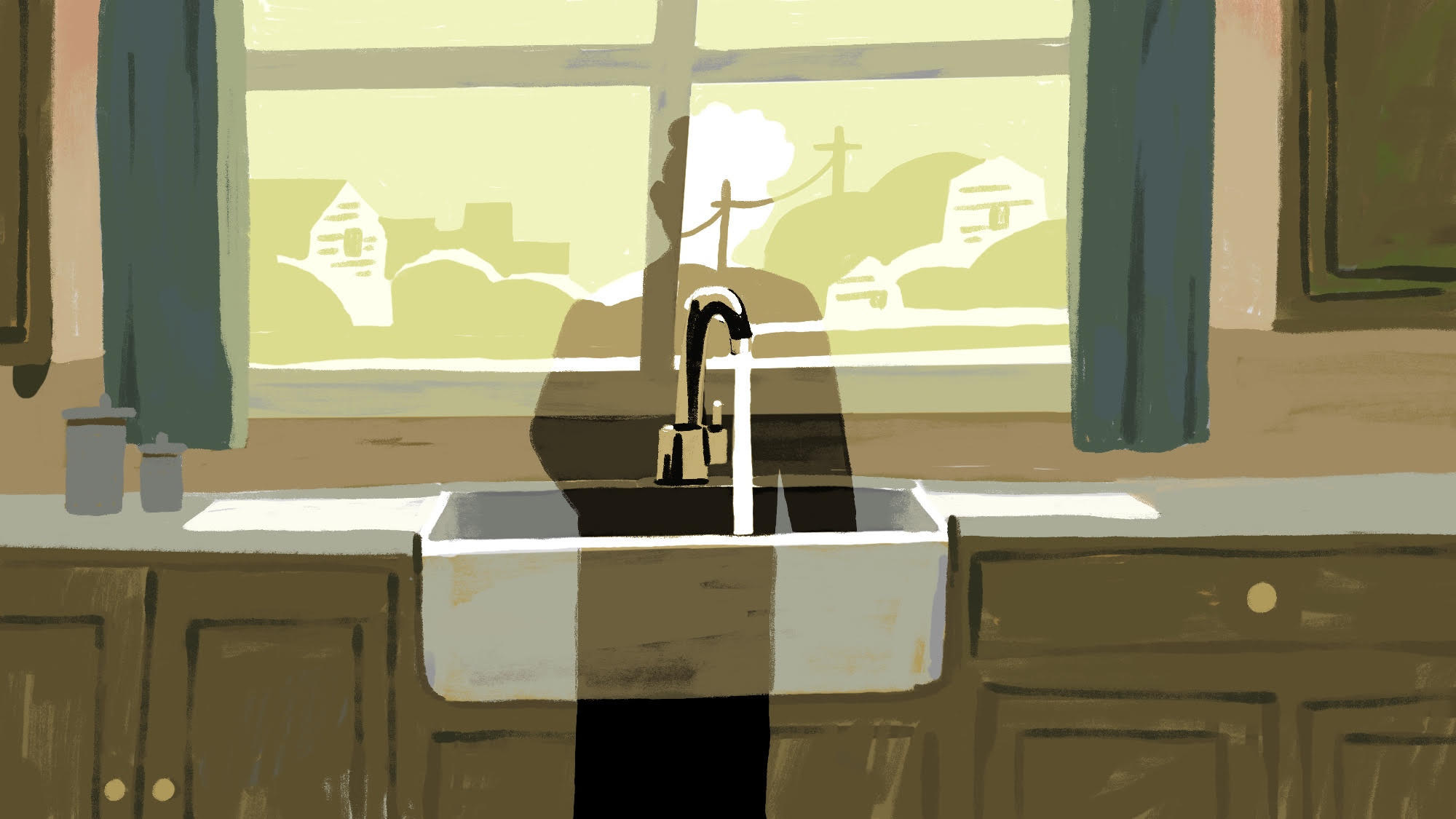 Silhouette of a woman standing at the kitchen sink