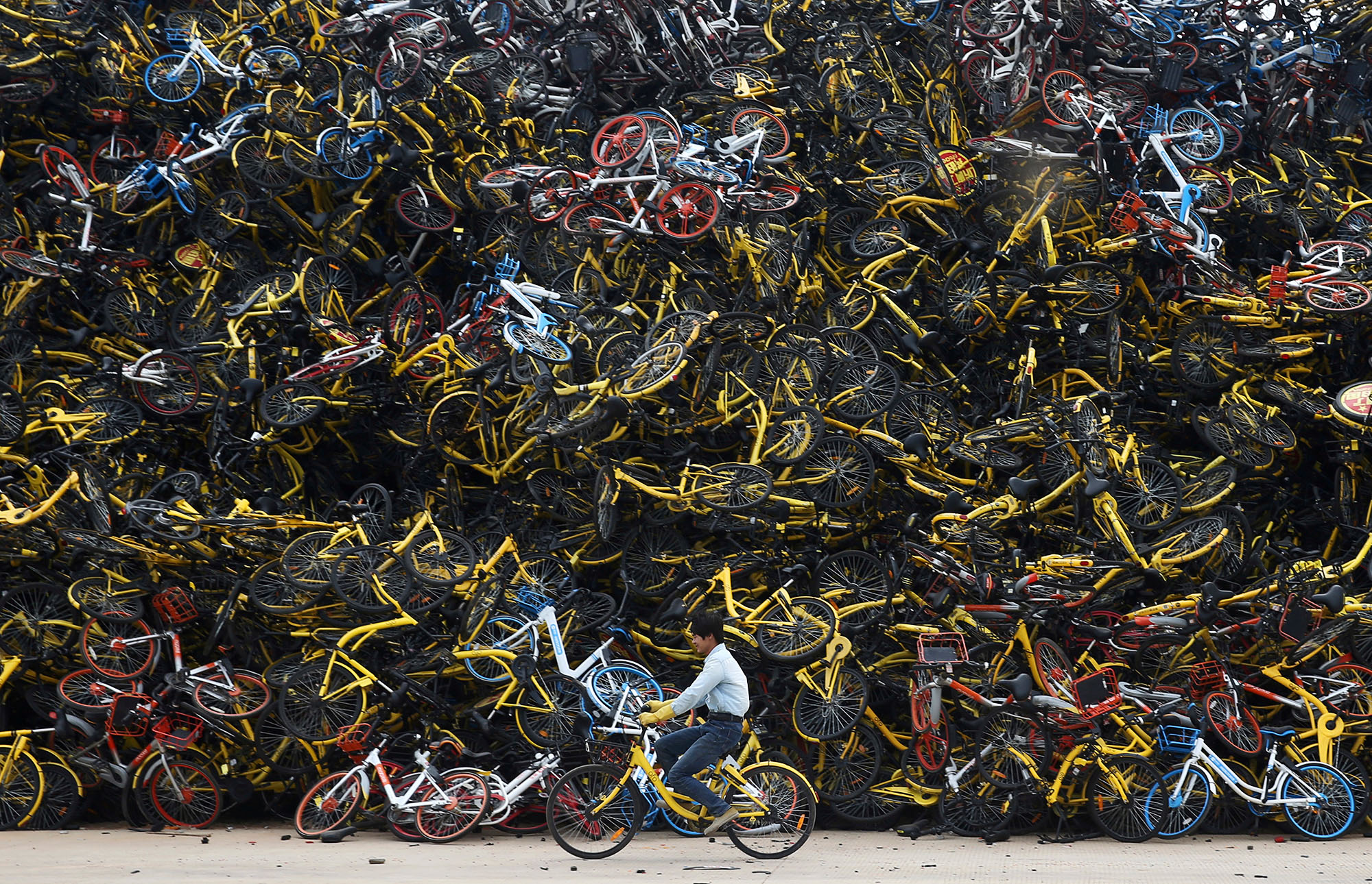 Bike Share Oversupply in China Huge Piles of Abandoned and Broken Bicycles 