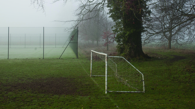 photograph of a misty soccer field