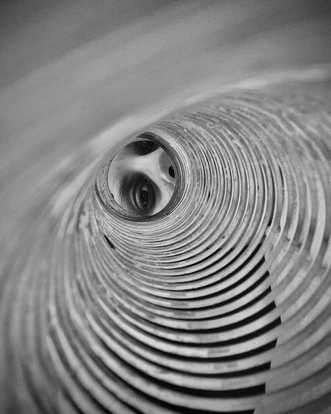 a face inside of a spiral