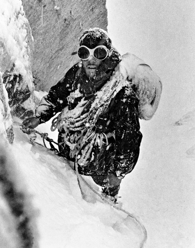 Photo of Douglas Tompkins climbing in snow, 1968