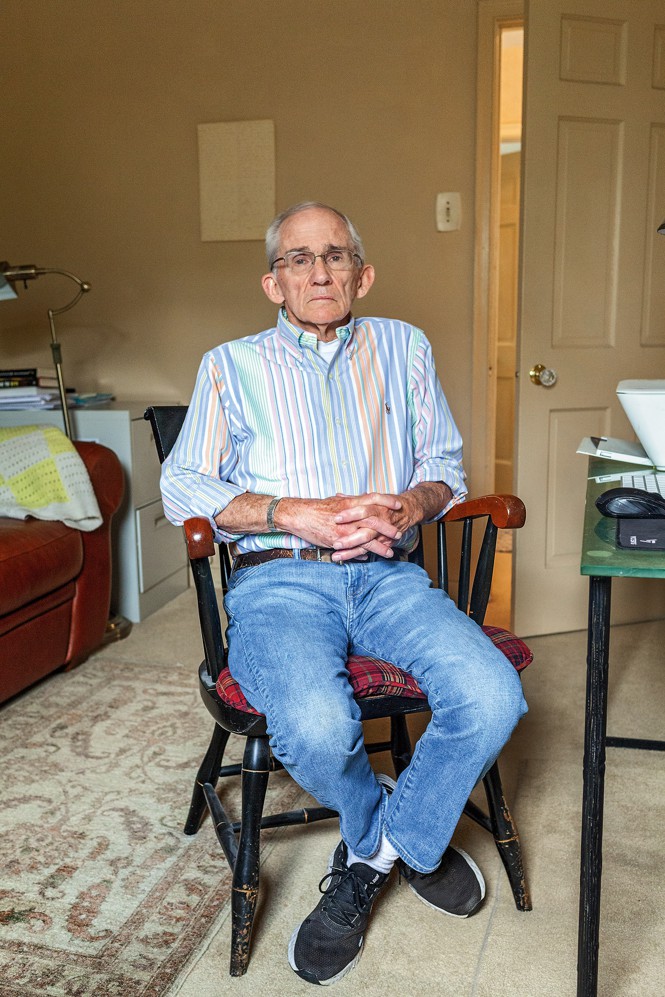 Photo of Bob McIlvaine Sr. sitting in wooden chair at desk