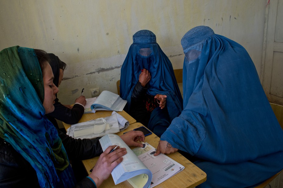 Women in burqas vote