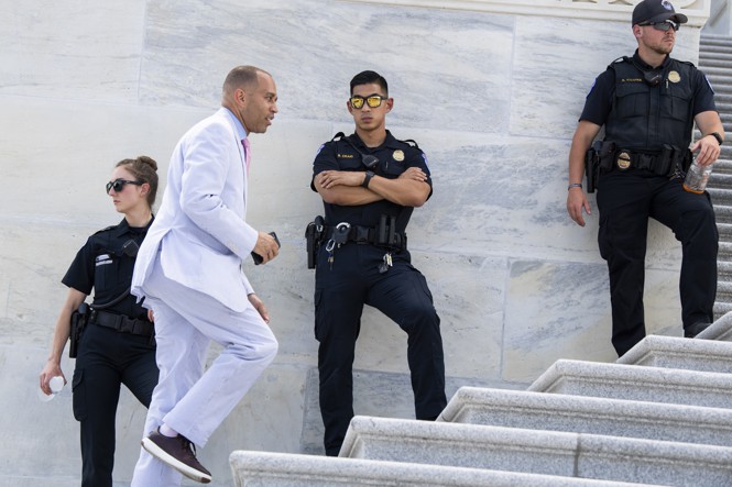 Hakeem Jeffries running up the Capitol steps.