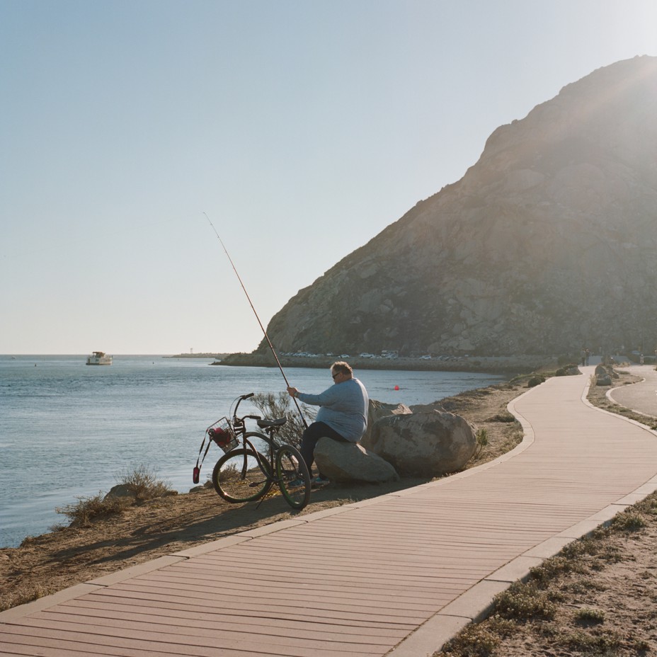 A fisherman on the Morro Bay Boardwalk