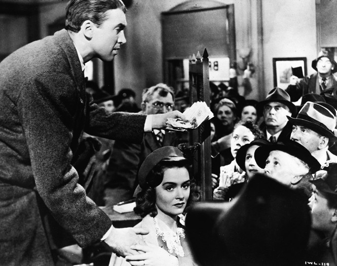 George Bailey talks to a crowd of panicked townspeople at his family's building and loan company in "It's a Wonderful Life.'