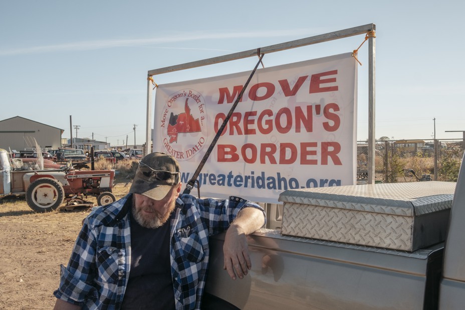 Gary Foster prepares a sign for a Move Oregon's Border meeting n Burns, Oregon on Saturday, October 16th. 