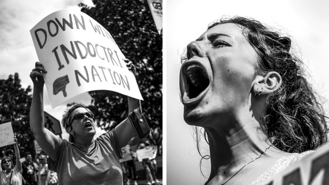 A woman holding up a sign with "Down with Indoctrination" and a woman yelling.