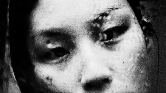 close up black and white photo of a woman's face