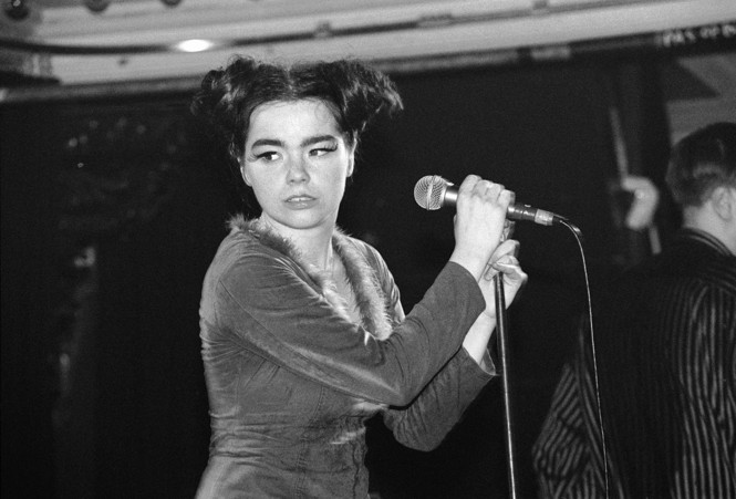 Young Bjork at a microphone in black and white