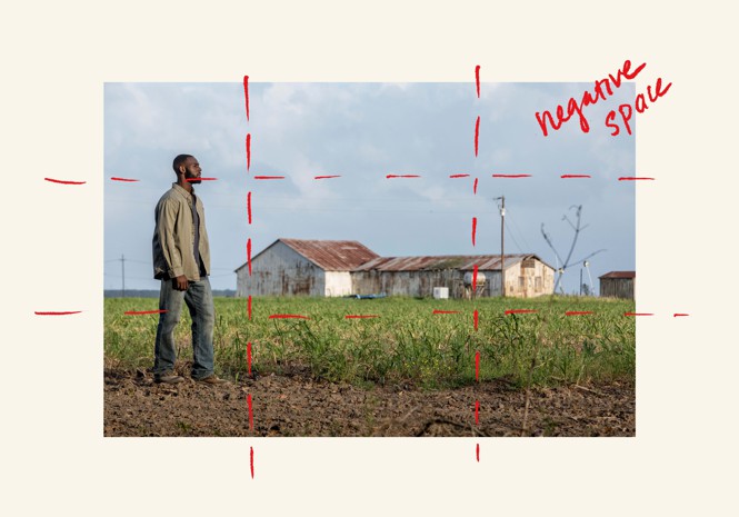 A character at the left edge of the frame, farmhouse in the background, with red dotted lines forming a 3x3 grid, and handwritten text that says "negative space"