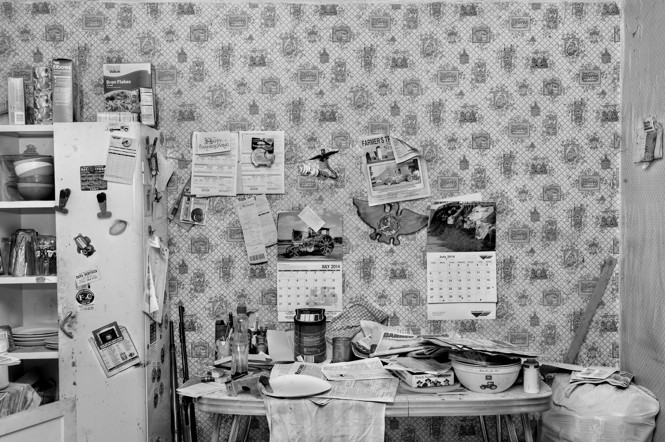A black-and-white photo of a cluttered room