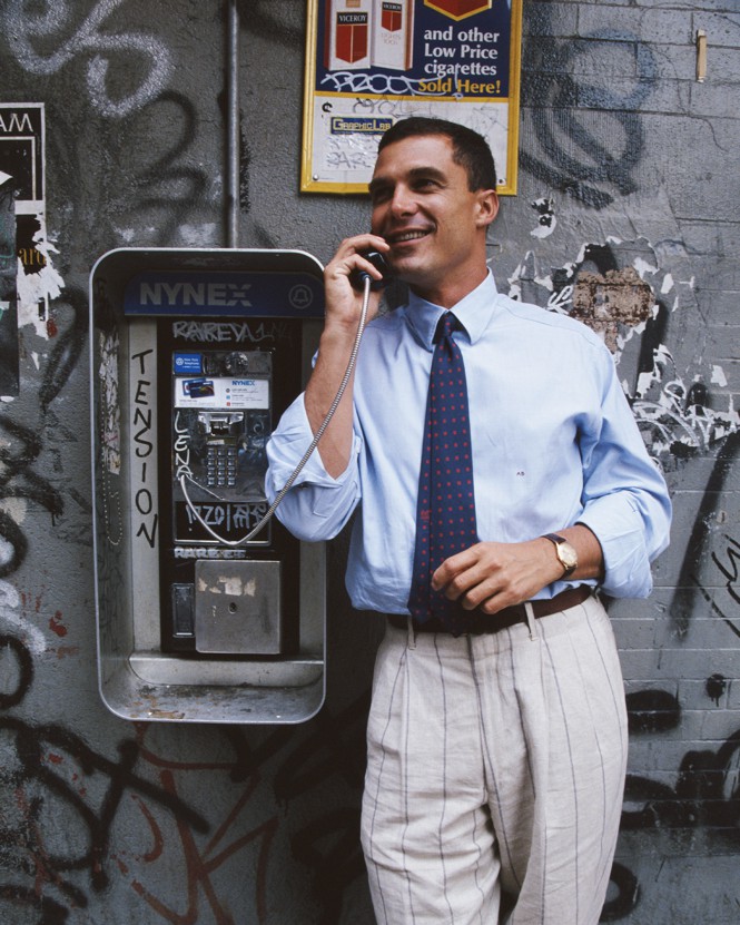 Andre Balazs posing at a public telephone in 1996