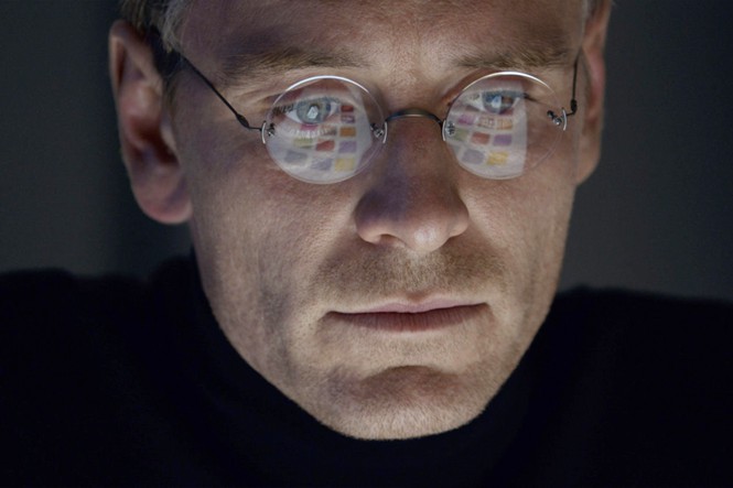 A close-up of Michael Fassbender as Steve Jobs, staring at a screen in the biopic 