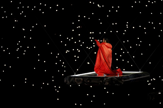 Rihanna performs on a suspended stage during the Super Bowl LVII Halftime Show.