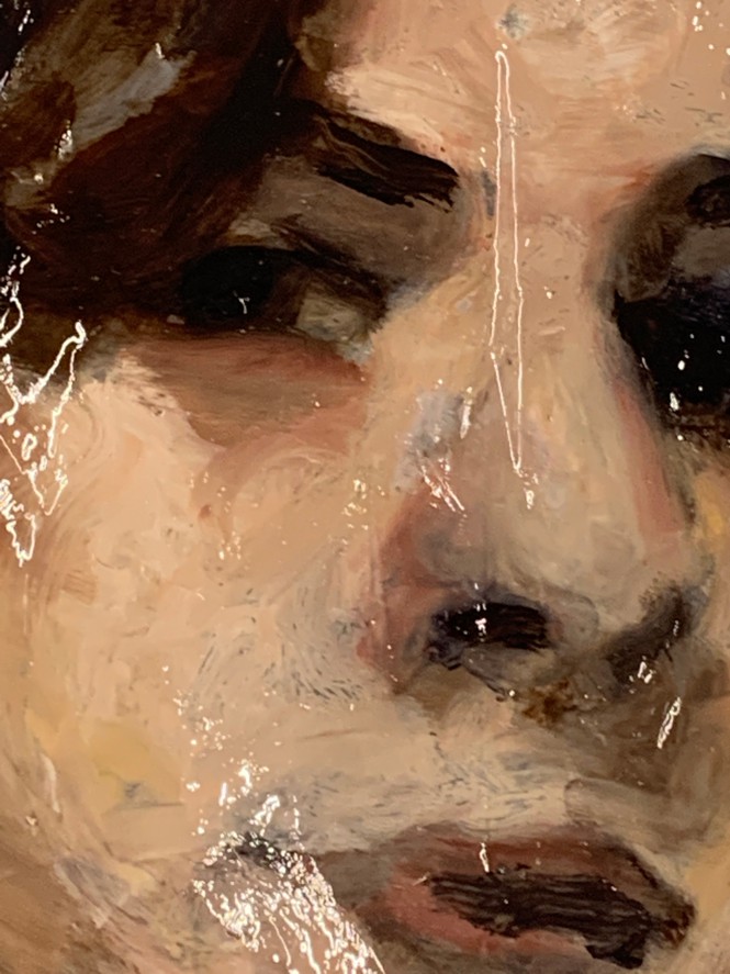 detail of oil painting of face with dark hair and eyes